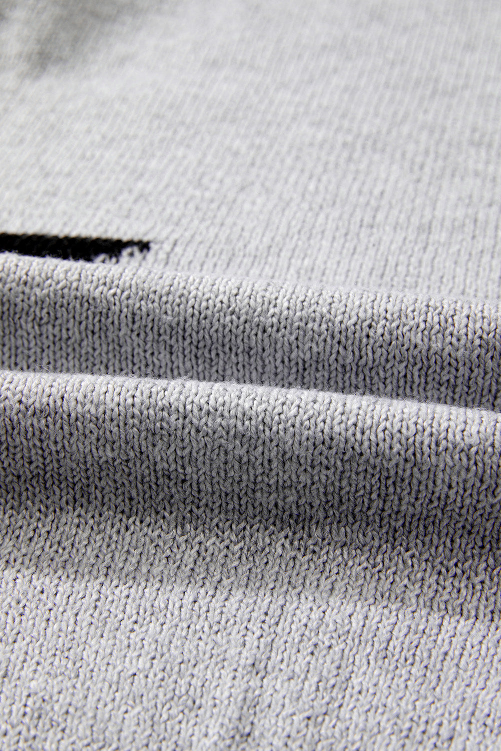Grauer Pullover mit überschnittener Schulter und Sternmuster