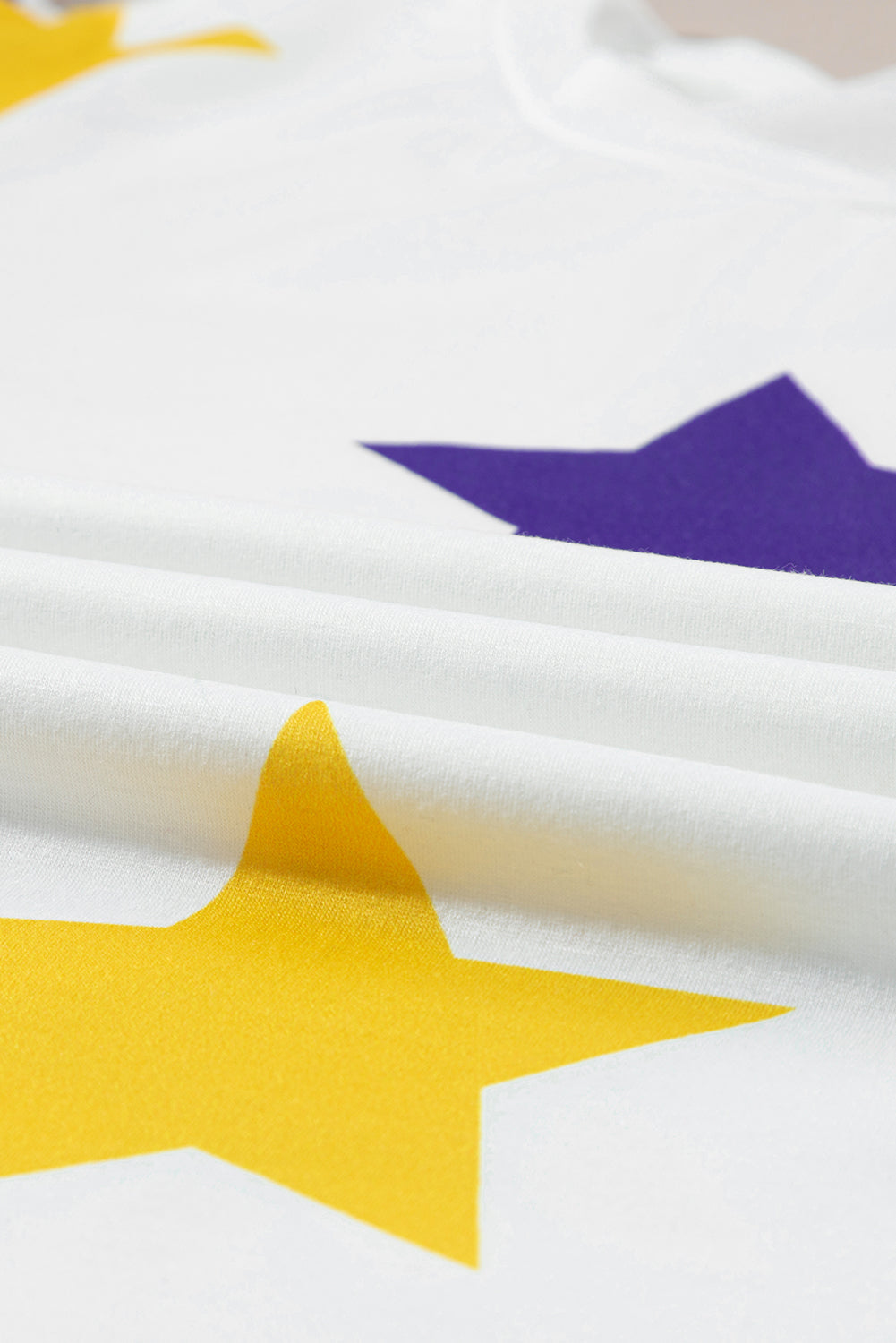 Weißes Langarmtop mit Mardi Gras-Stern-Aufdruck