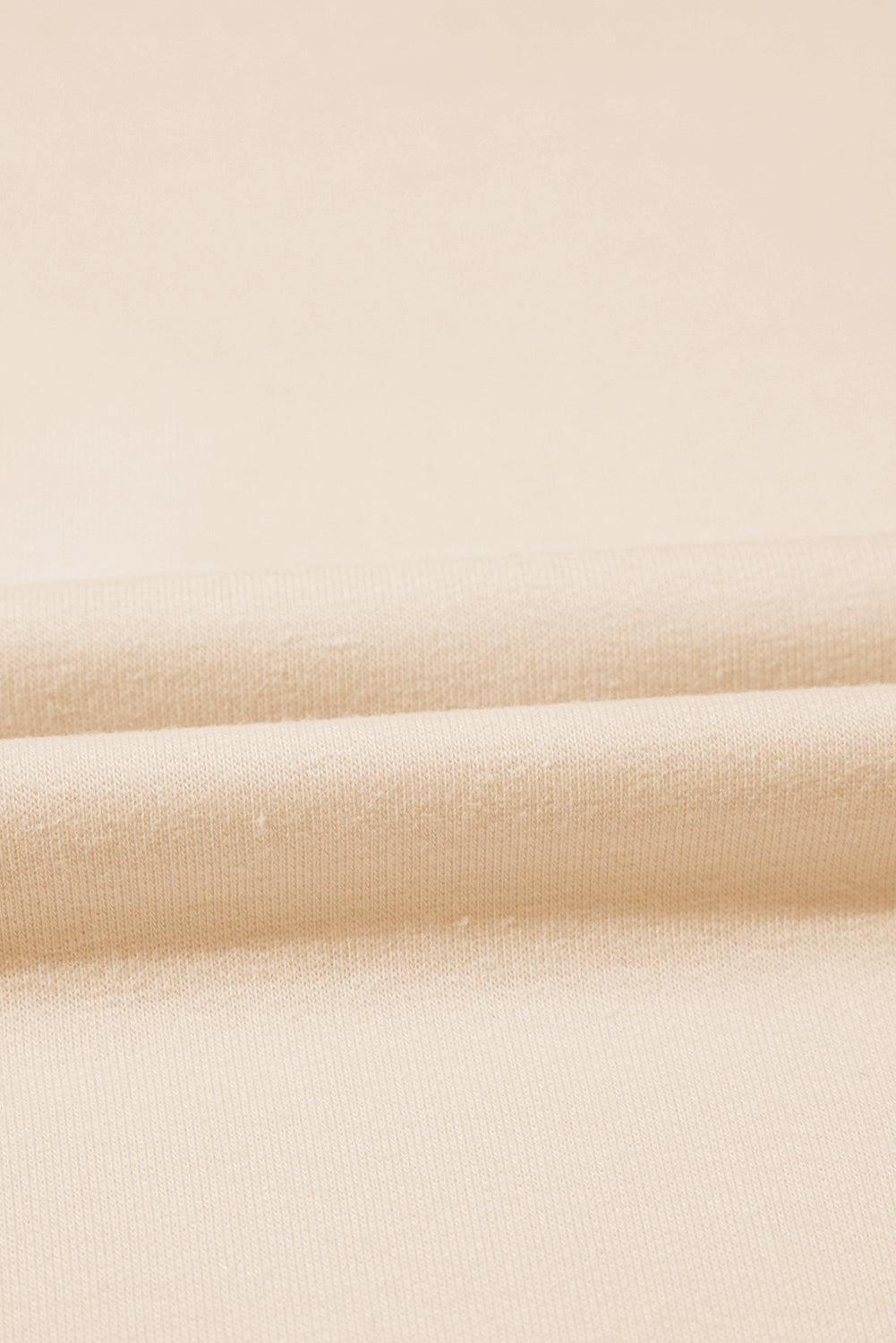 Beiges T-Shirt mit Rundhalsausschnitt und Nieten in Sternform in Übergröße