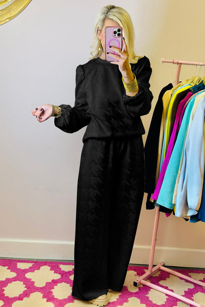 Schwarzes Set aus Oberteil und Hose mit Puffärmeln und Struktur