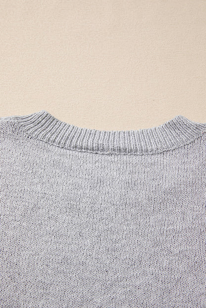 Grauer Pullover mit überschnittener Schulter und Sternmuster