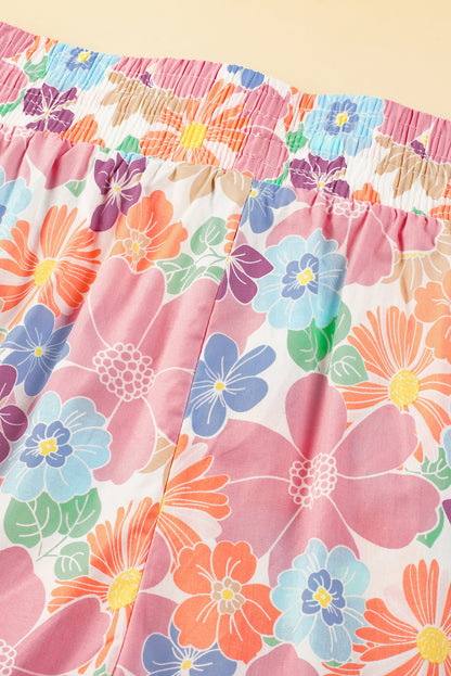 Rosafarbene, lockere Hose mit gesmoktem Bund und Blumenmuster