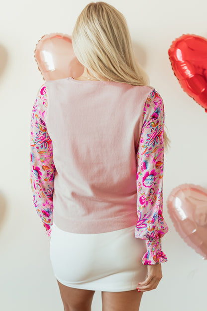 Haferflockenfarbenes Strickoberteil mit Patchwork-Blumenmuster und gesmokten Laternenärmeln