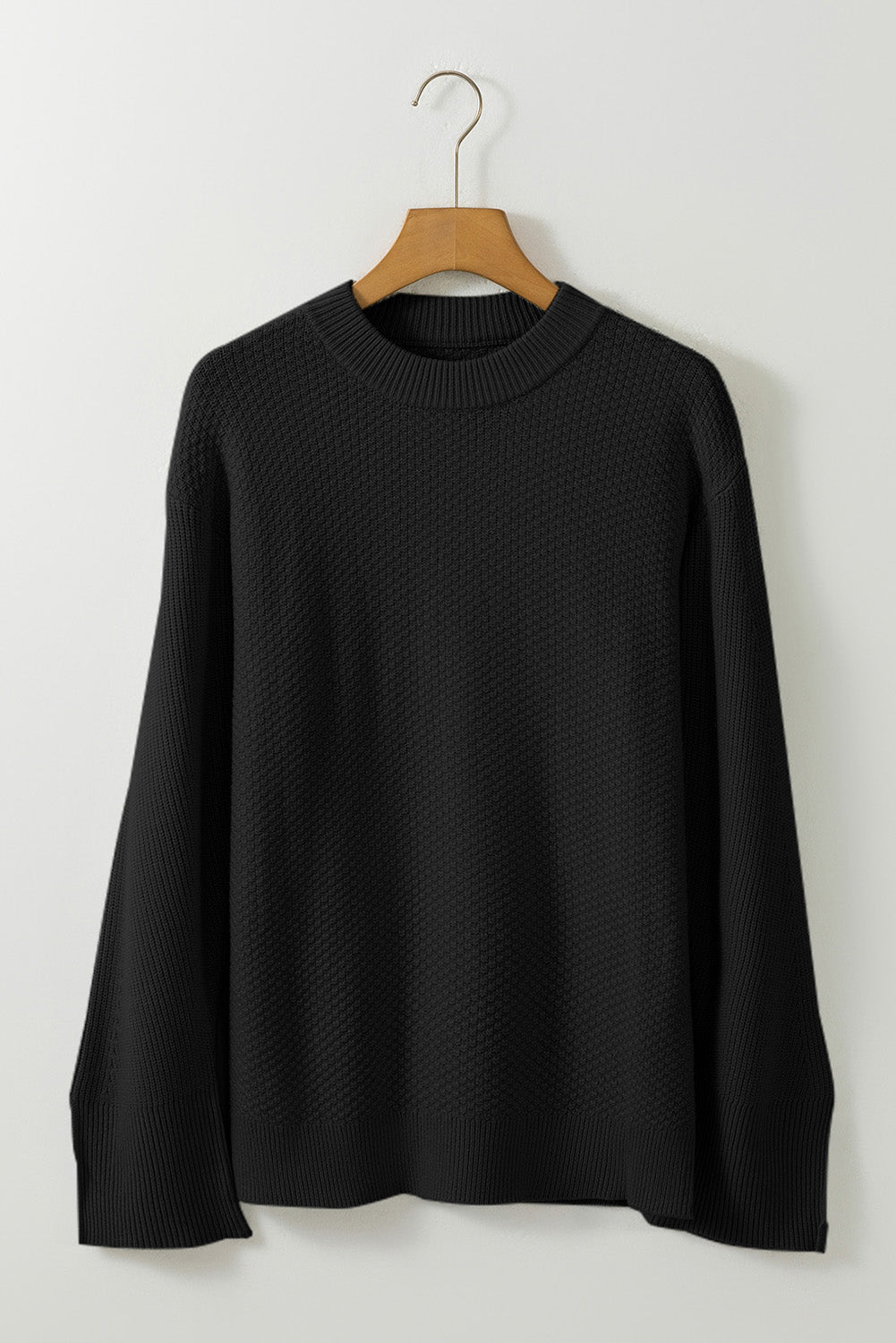 Schwarzer, unifarbener, strukturierter Strickpullover mit geteilten Bündchen und überschnittener Schulter