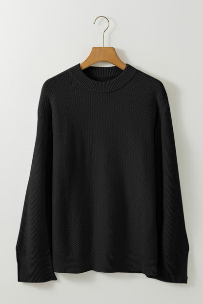 Schwarzer, unifarbener, strukturierter Strickpullover mit geteilten Bündchen und überschnittener Schulter