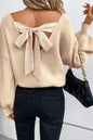 Aprikosenfarbener Pullover mit Laternenärmeln und V-Ausschnitt und Knoten hinten