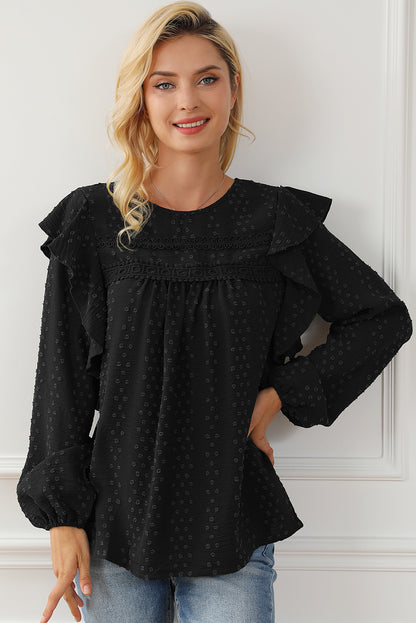 Schwarze Bluse mit langen Ärmeln und Ösen an der Schulter aus Spitze und Rüschen