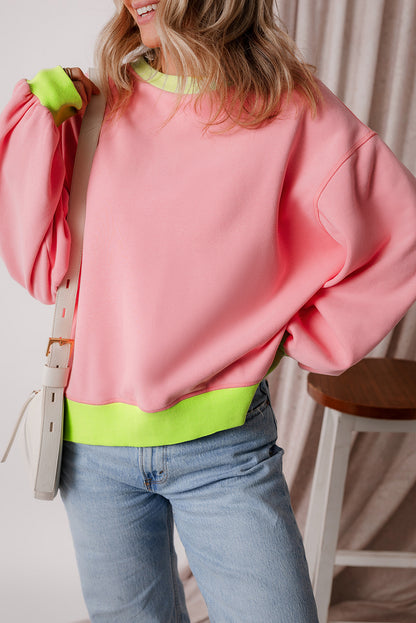 Rosa Sweatshirt mit Farbblock-Muster und Puffärmeln