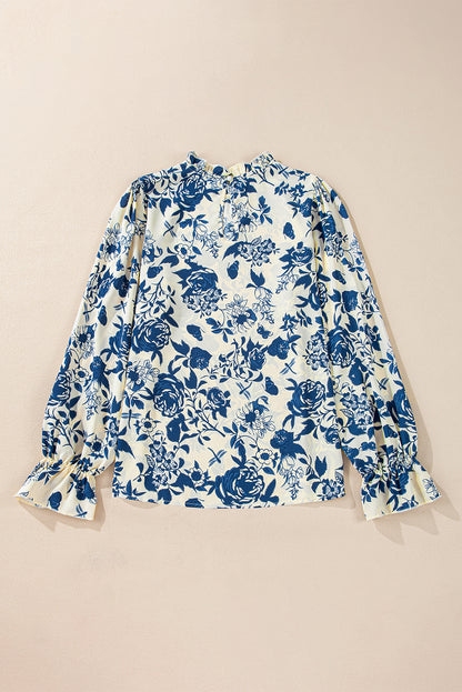 Himmelblaue Bluse mit Blumenmuster, Volantärmeln und Schlüsselloch hinten
