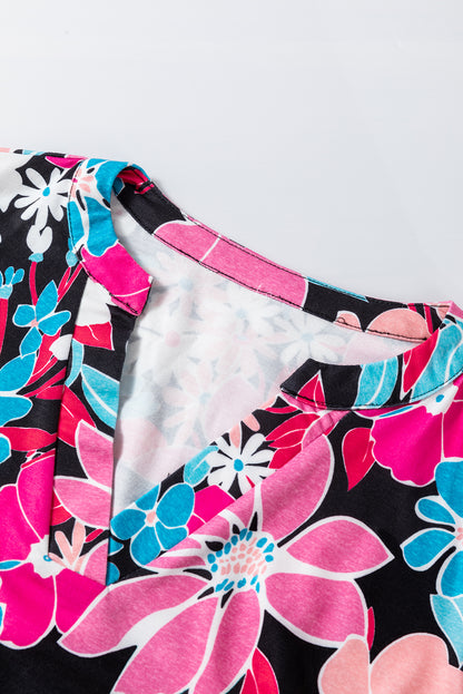 Rosa Bluse mit V-Ausschnitt und Rolllaschenärmeln und Blumenmuster