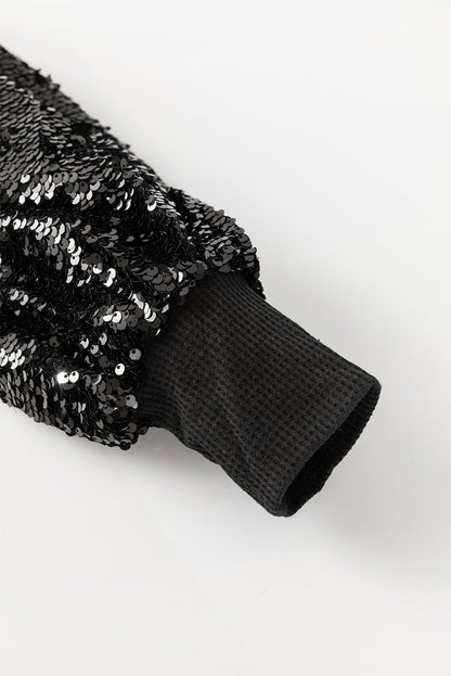 Schwarze Bluse mit Pailletten-Patchwork und Laternenärmeln
