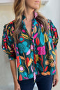 Grüne Bluse mit Blumenmuster, Puffärmeln und V-Ausschnitt