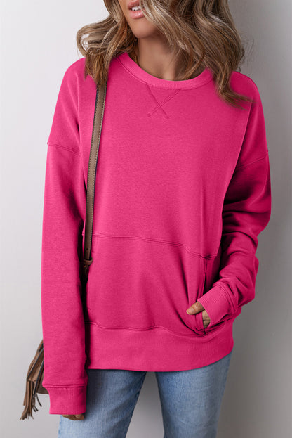 Rosarotes, lockeres Sweatshirt mit überschnittenen Schultern, überkreuzten Nähten und Taschen