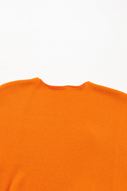 Orangefarbener, lockerer Strickcardigan mit Blumenmuster und offener Vorderseite