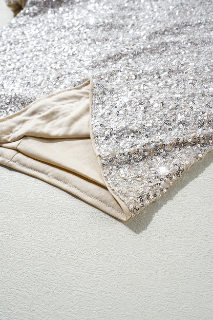 Silberne Bluse mit Pailletten, Puffärmeln und Cut-Out am Rücken