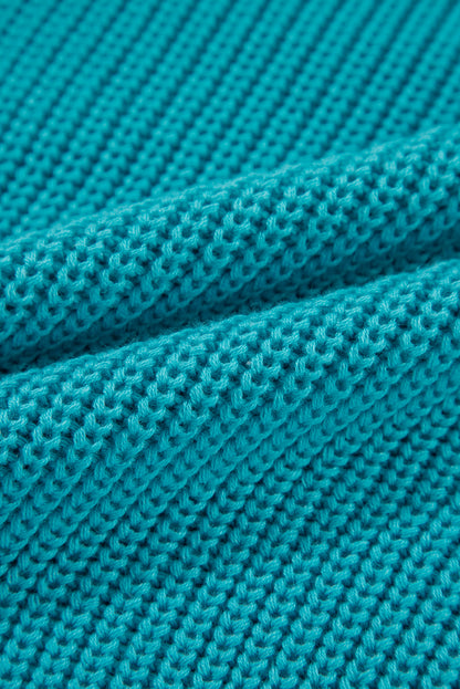 Türkisfarbener Pullover mit gerüschten Ösenärmeln