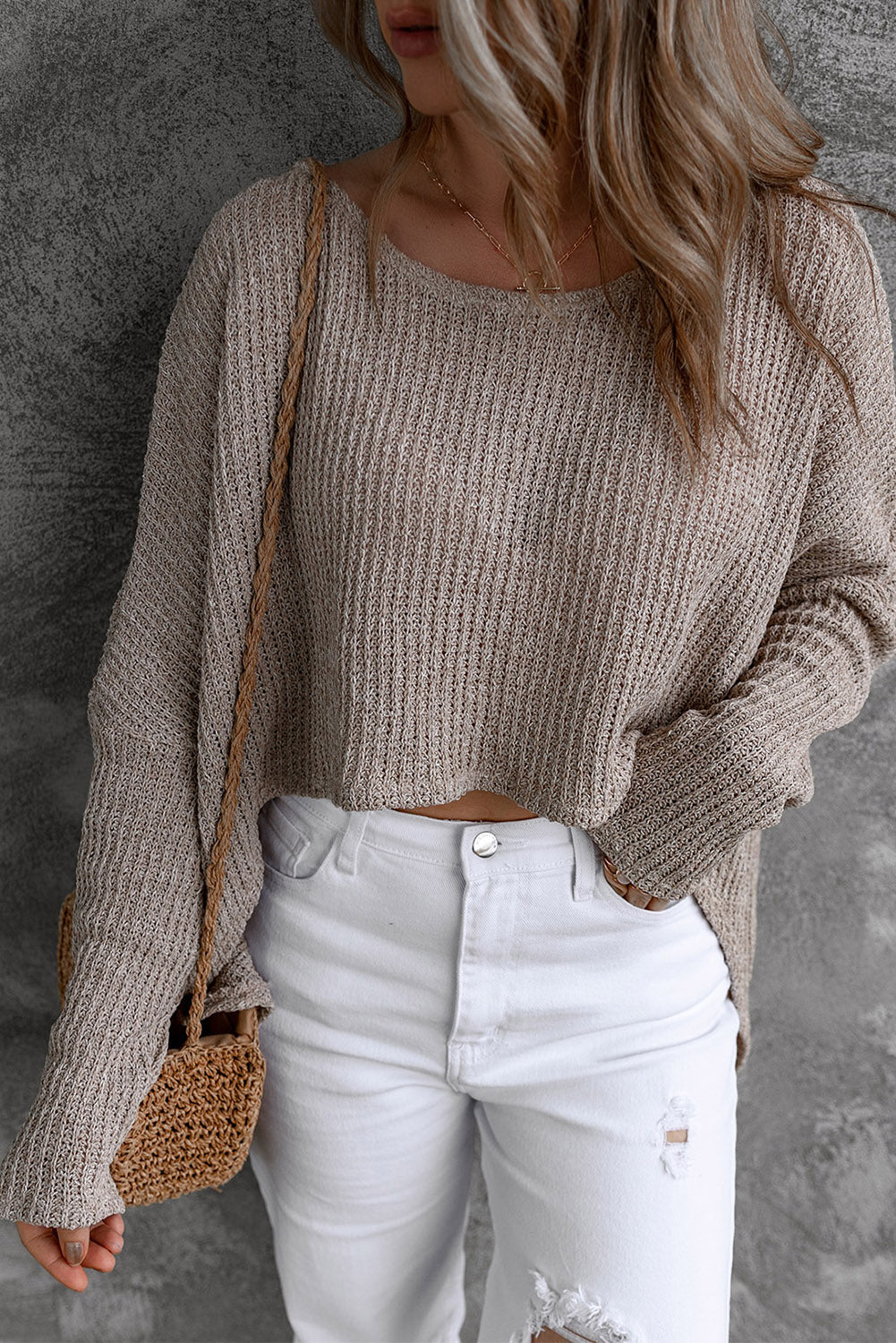 Grauer, lässiger Pullover mit Dolman-Ärmeln und hohem Bund