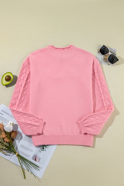 Gestrickter Pullover mit gekerbtem Kragen und Pfirsichblüten-Detail