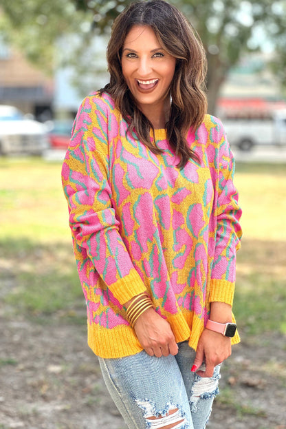 Vitality – Orangefarbener Baggy-Pullover mit abstraktem Print und geripptem Saum