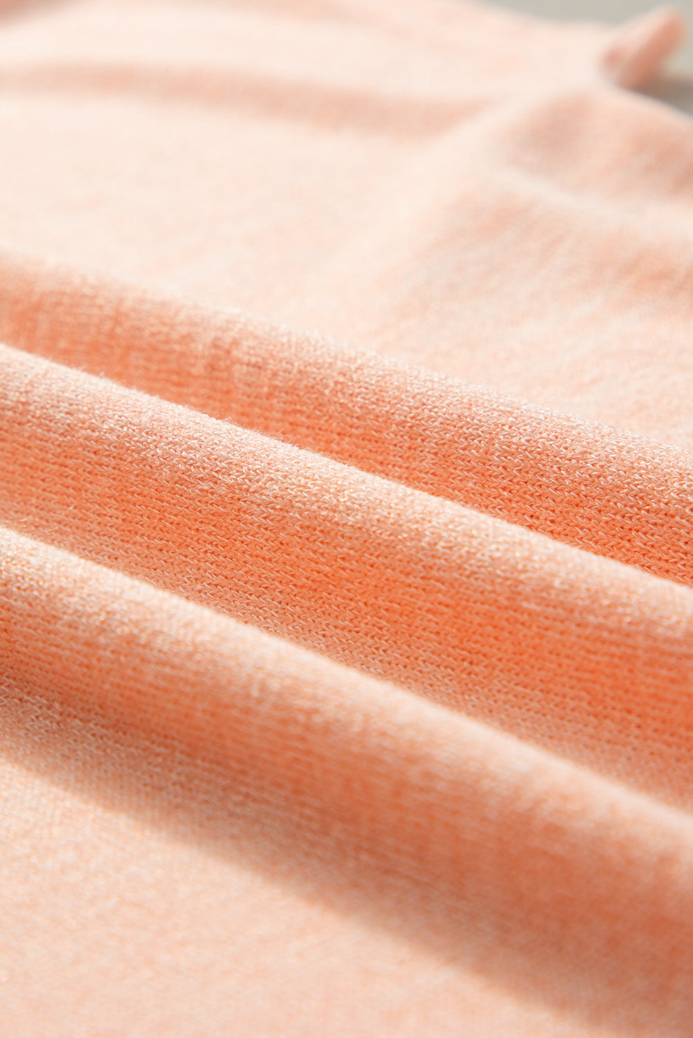 Aprikosenrosa Lässiges T-Shirt mit Fledermausärmeln und Knopfdetail