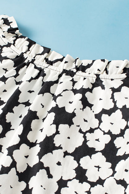 Schwarze Bluse mit floralem Kontrastmuster und Zickzackmuster und Rüschenärmeln