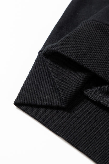 Schwarzes Lametta-Sweatshirt mit Game Day-Grafik und überschnittener Schulter