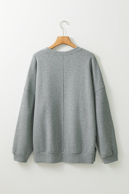 Mittelgraues Oversize-Oberteil mit seitlichem Schlitz und überschnittener Schulter