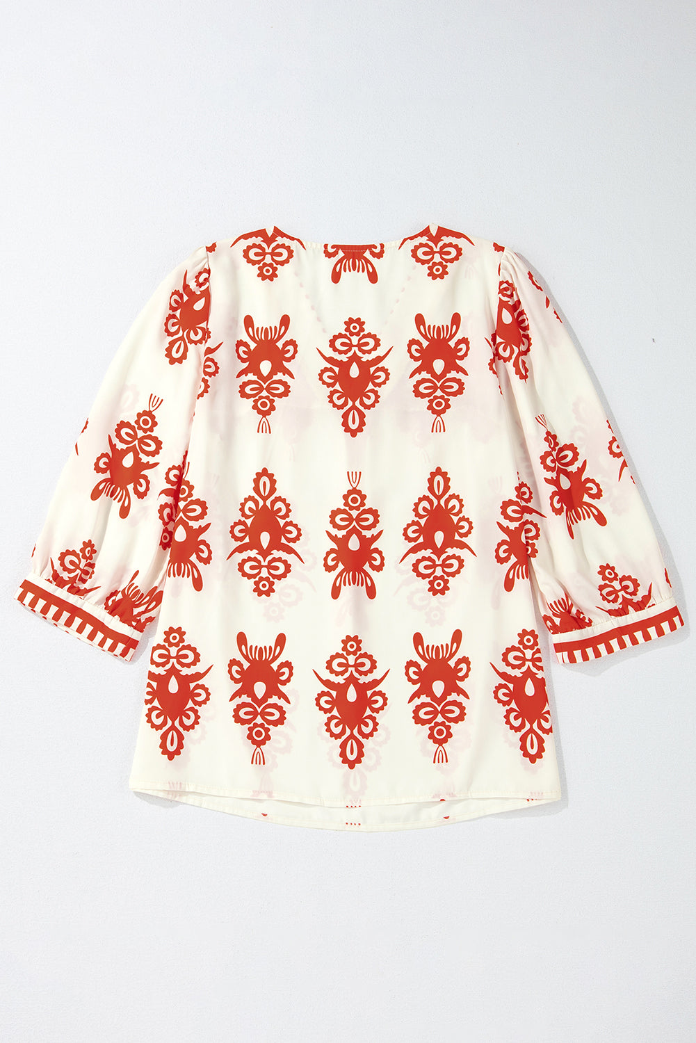 Orangefarbene Bluse mit 3/4-Ärmeln und V-Ausschnitt im Vintage-Stil mit geometrischem Muster