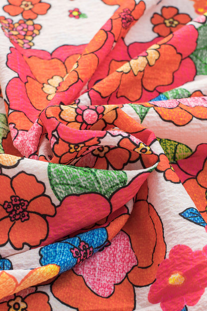 Feurig rotes Top mit Blumenmuster und Schlitz am Ausschnitt