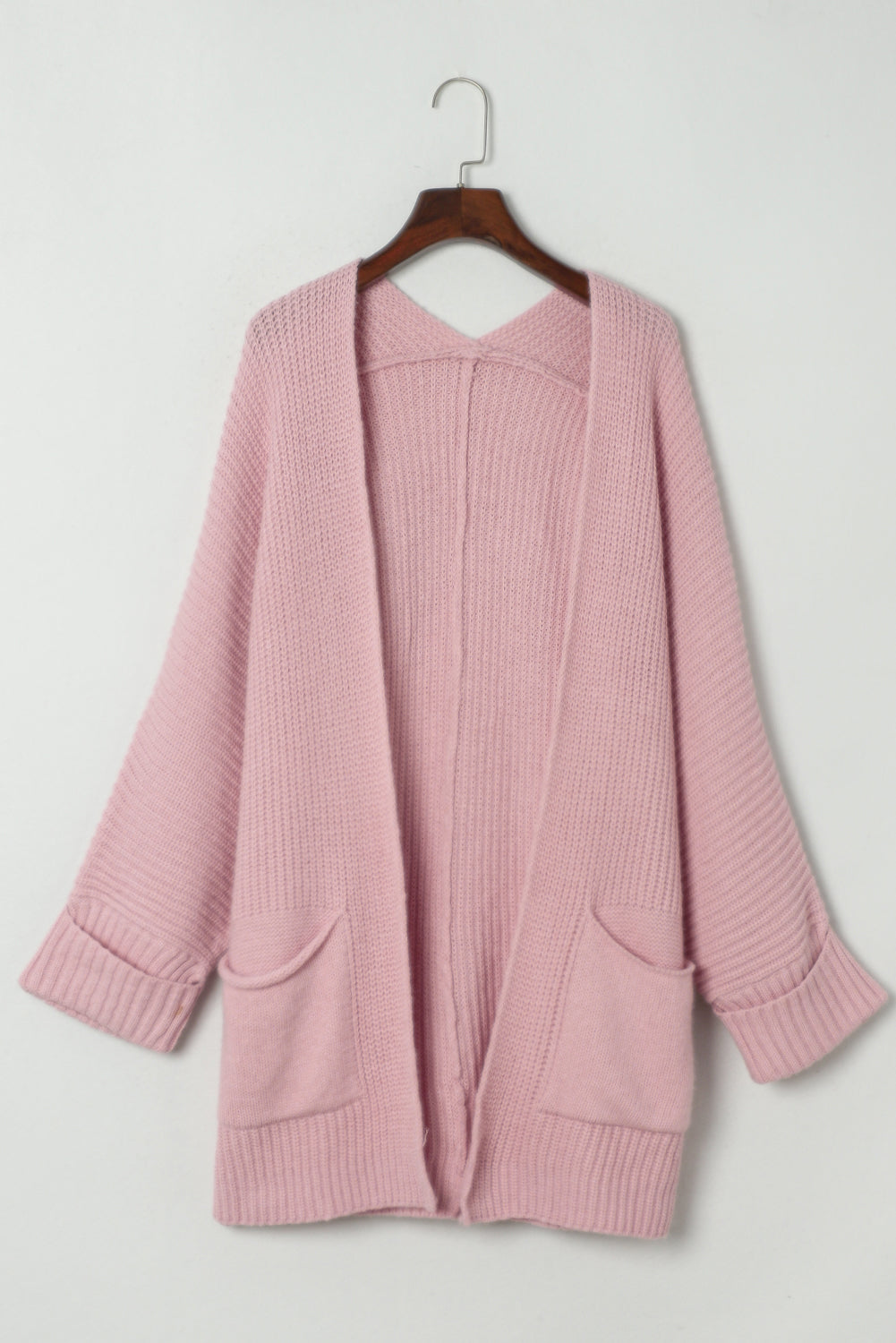 Rosafarbener Oversize-Strickpullover mit umgeschlagenen Ärmeln
