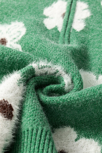 Grüner Pullover mit Blumenmuster und halblangem Reißverschluss sowie überschnittenen Schultern