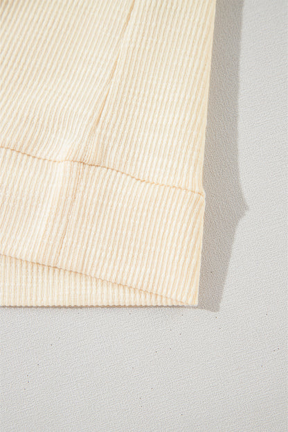 Aprikosenfarbene Bluse mit strukturiertem Patchwork und Ballonärmeln