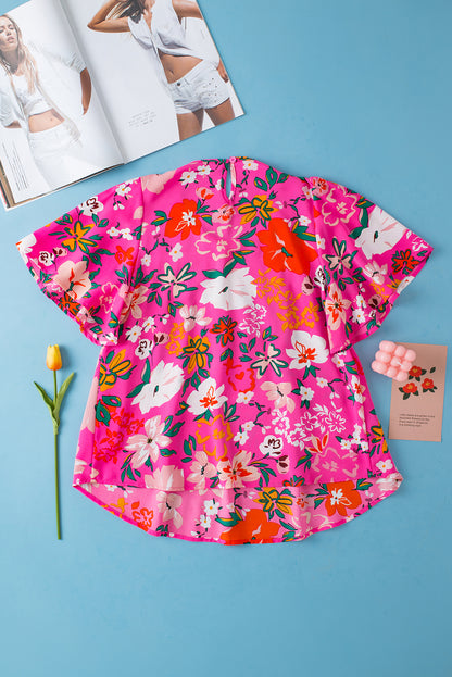 Rosa, gesmoktes, kurzärmliges Blusenkleid mit Blumenmuster