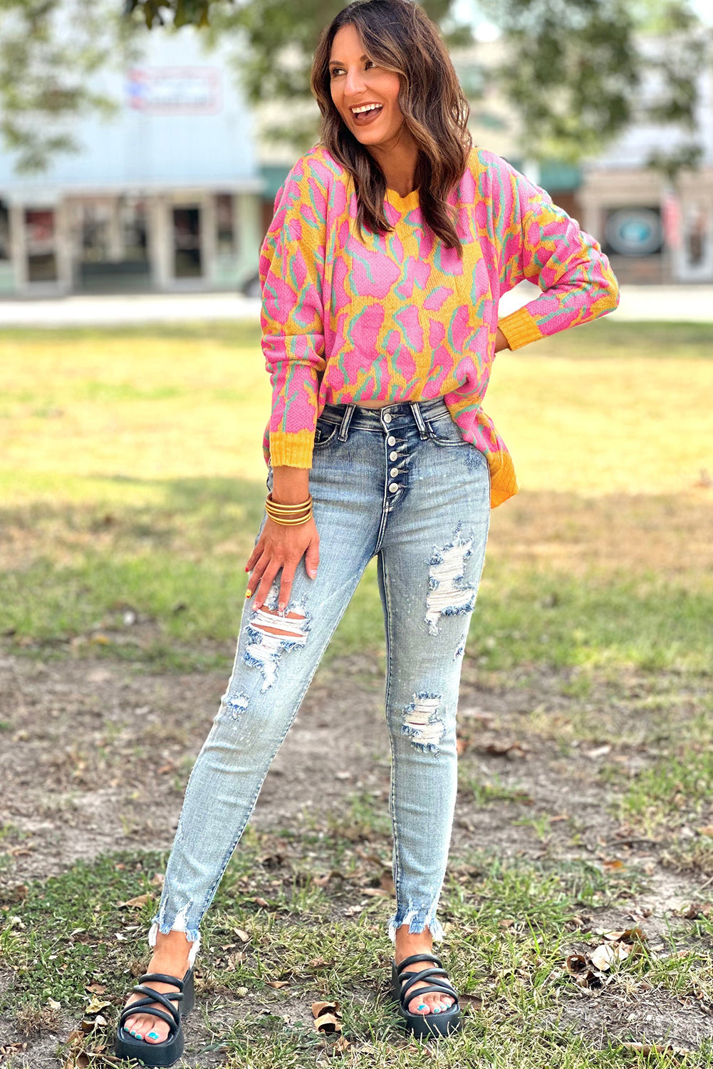 Vitality – Orangefarbener Baggy-Pullover mit abstraktem Print und geripptem Saum