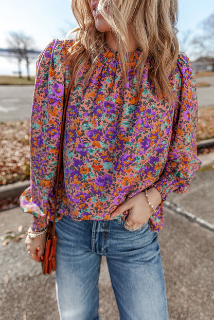 Lila Bluse mit Rundhalsausschnitt, Blumenmuster und gerafften Bündchen