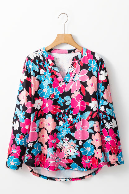 Rosa Bluse mit V-Ausschnitt und Rolllaschenärmeln und Blumenmuster