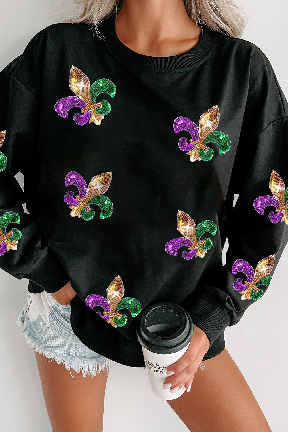 Schwarzes Pullover-Sweatshirt mit Mardi Gras-Grafik und Pailletten
