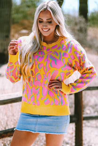 Vitality – Orangefarbener Baggy-Pullover mit abstraktem Print und geripptem Saum
