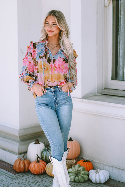 Rosa Bluse mit Blumenmuster und Rüschen