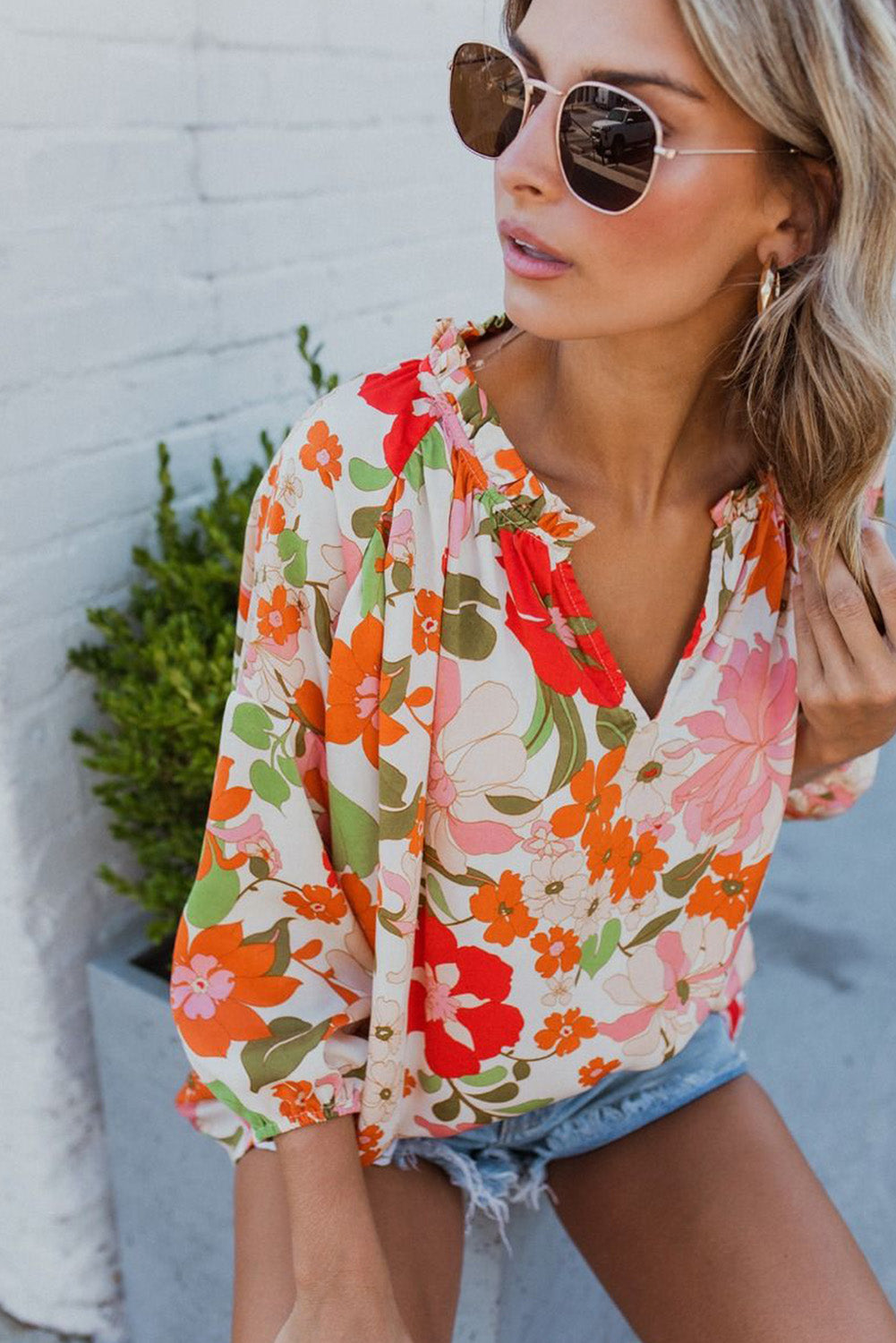 Orangefarbene Bluse mit Puffärmeln und Rüschenbesatz