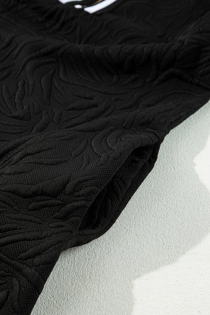 Schwarzes, strukturiertes Jacquard-Minikleid mit Viertelreißverschluss