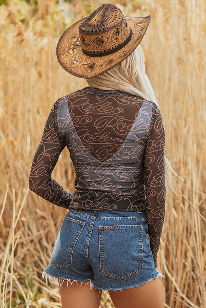 Schwarzes, langärmliges Netzoberteil mit Stehkragen und Western-Rodeo-Print