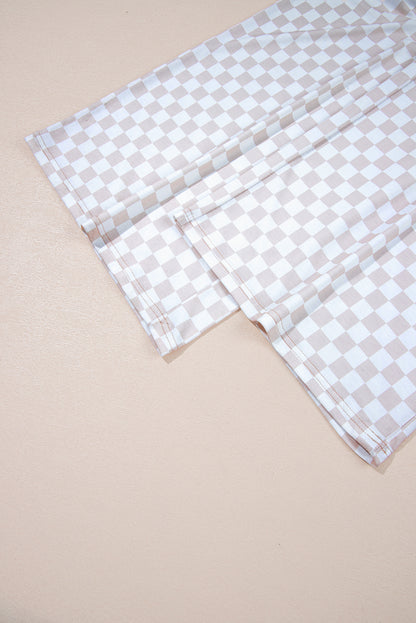 Aprikosenfarbener Jumpsuit mit weitem Bein und Karomuster, Rundhalsausschnitt und Knöpfen