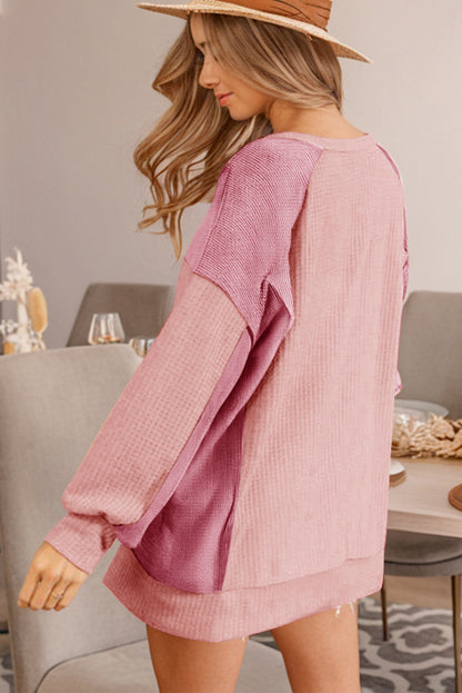 Aprikosenrosa Farbblock-Sweatshirt mit Waffelmuster und hohen, niedrigen Raglanärmeln