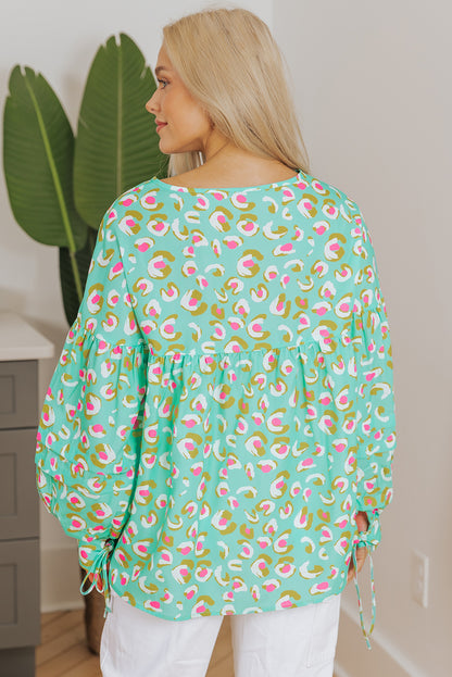 Grüne Babydoll-Bluse mit abstraktem Print und Schnürung und Laternenärmeln