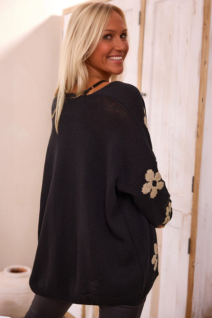 Schwarzer, lockerer Strickcardigan mit Blumenmuster und offener Vorderseite