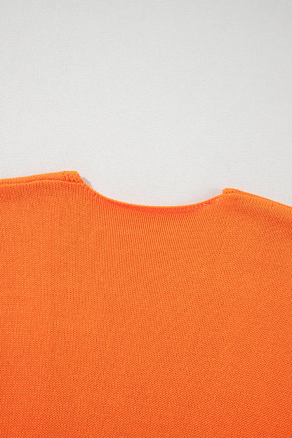 Orangefarbener, lockerer Strickcardigan mit Blumenmuster und offener Vorderseite