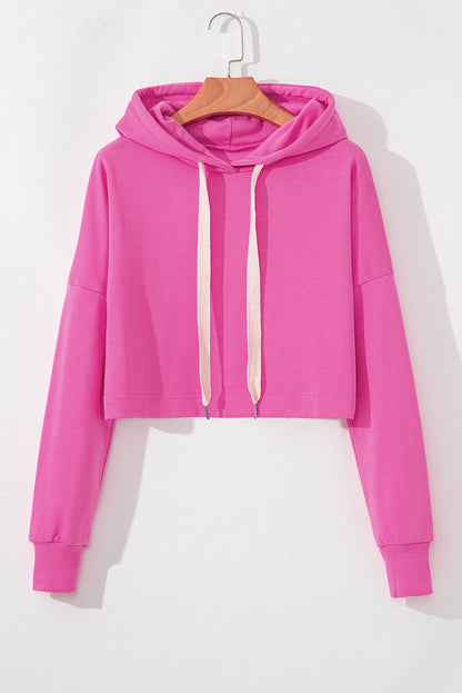 Sachet – Rosafarbener, einfarbiger, kurzer Hoodie mit überschnittener Schulterpartie und Kordelzug