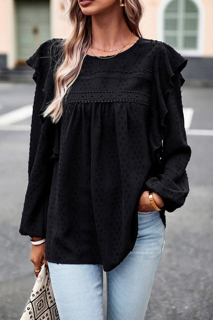 Schwarze Bluse mit langen Ärmeln und Ösen an der Schulter aus Spitze und Rüschen