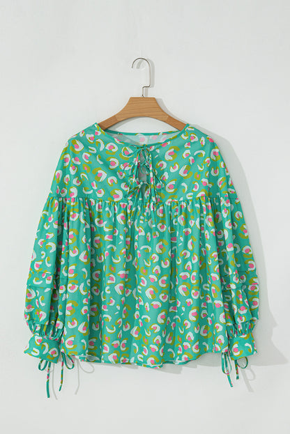 Grüne Babydoll-Bluse mit abstraktem Print und Schnürung und Laternenärmeln